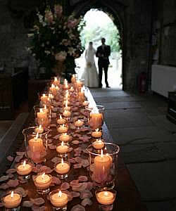 Twinkling candles adorn the church